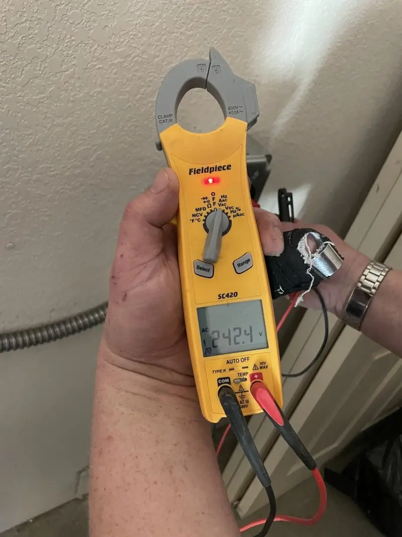 Voltage testing with clamp meter during Ceiling Fan Installation in Pownal